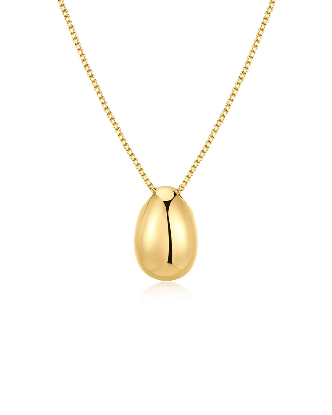 Gold egg-shaped pendant on a chain against a white background