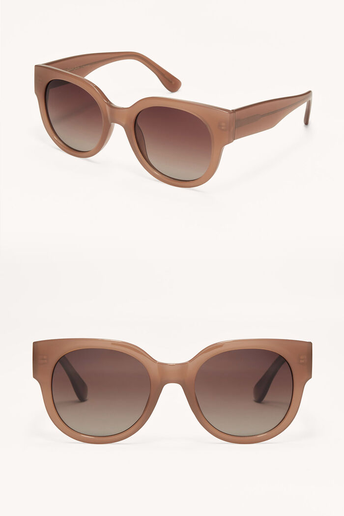 Brown sunglasses with gradient lenses on a white background