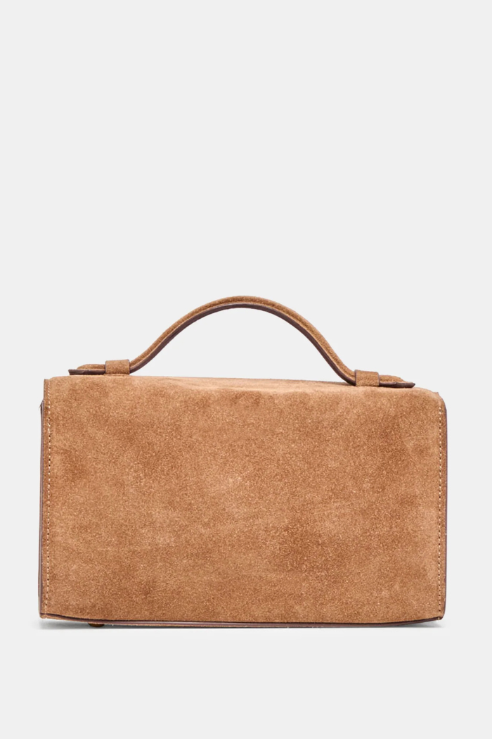 Brown leather handbag on a light gray background