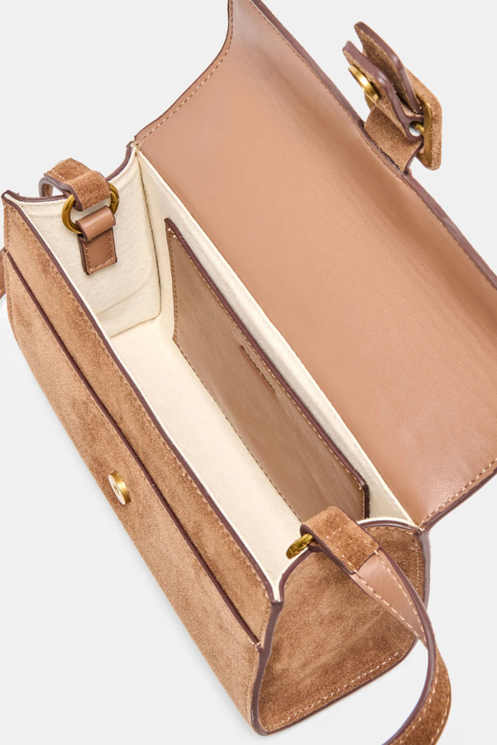 Brown handbag with gold hardware on a white background
