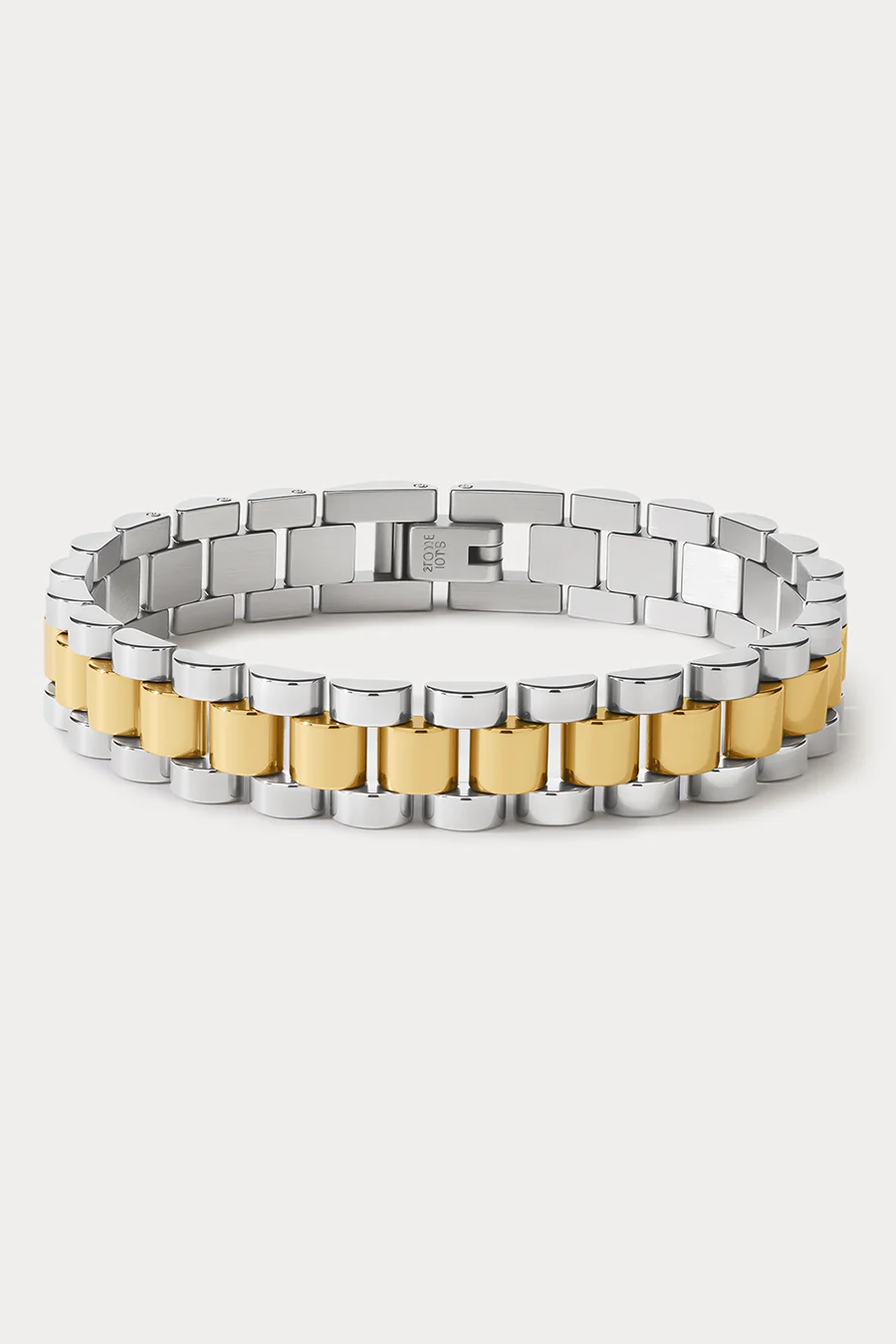 Two-tone silver and gold bracelet on a white background