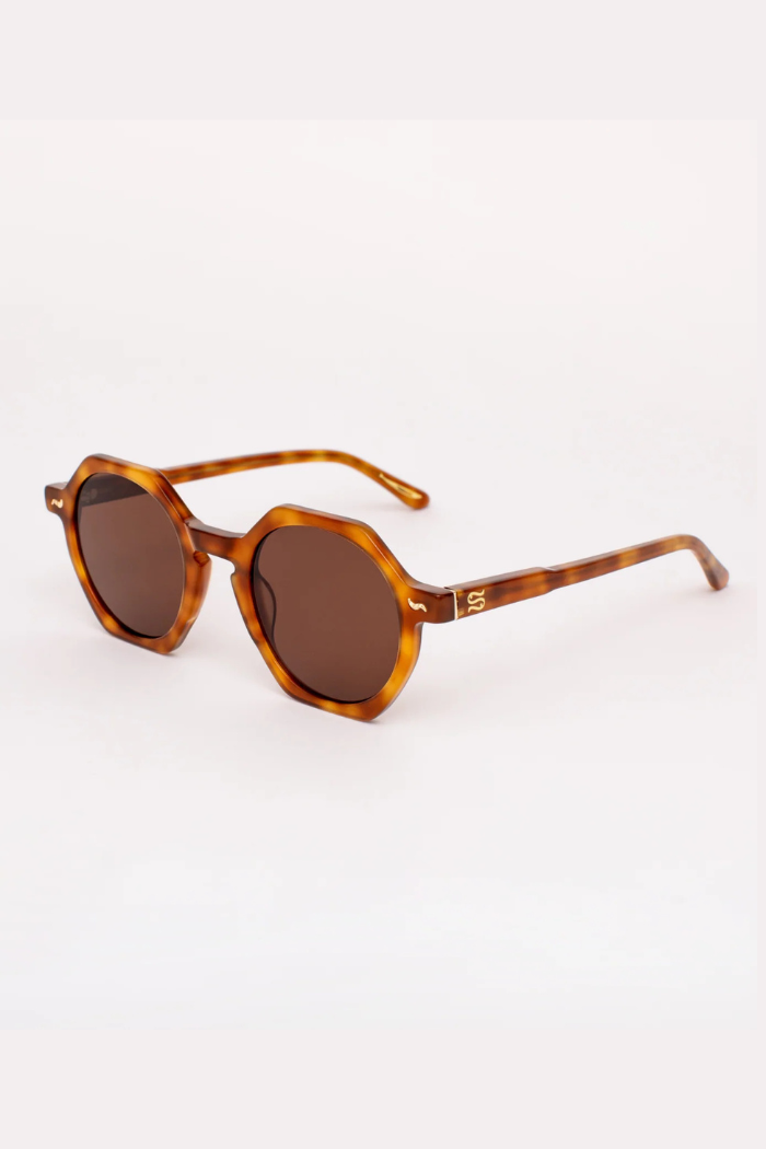 Brown sunglasses with tortoiseshell frame on a white background
