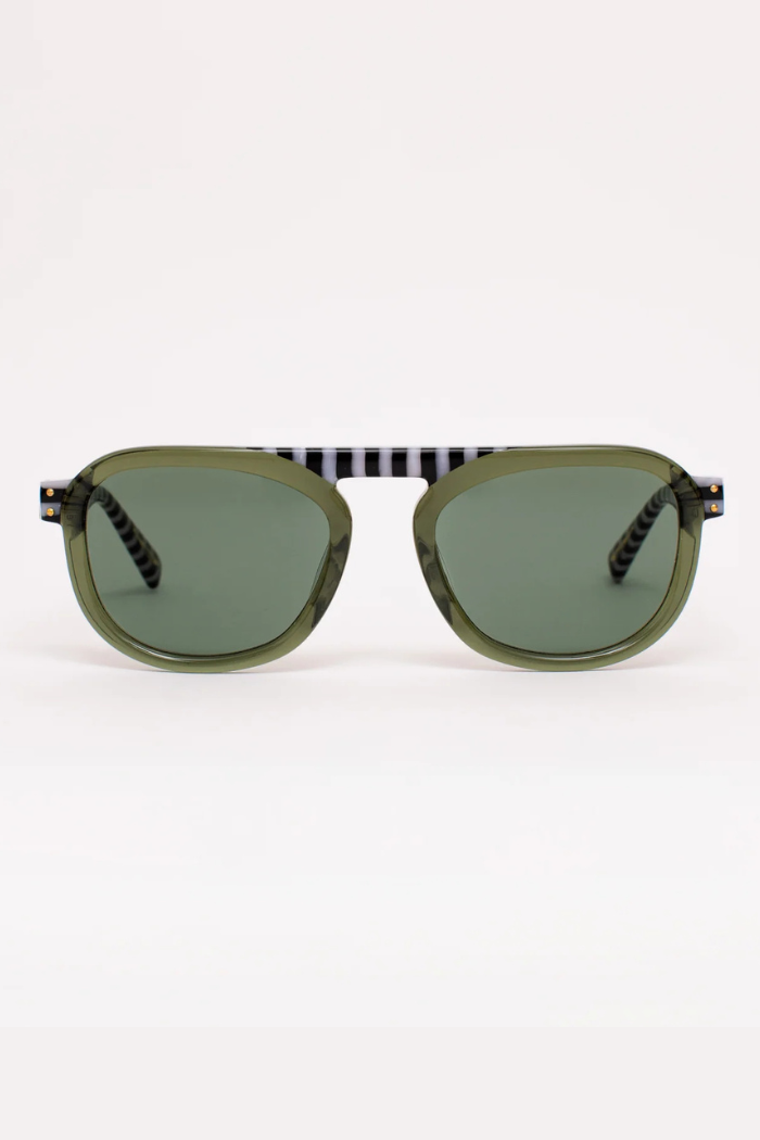 Sunglasses with green lenses and black frames on a white background