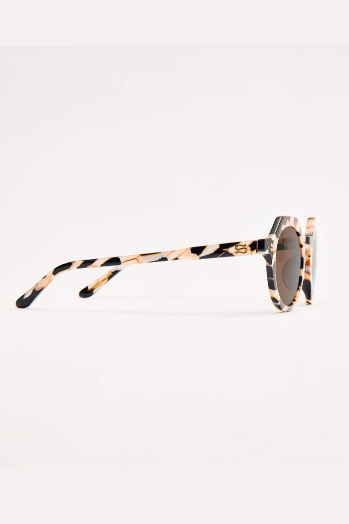 Sunglasses with tortoiseshell frame on a white background