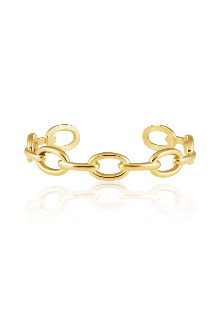 Gold chain-style ring on a white background