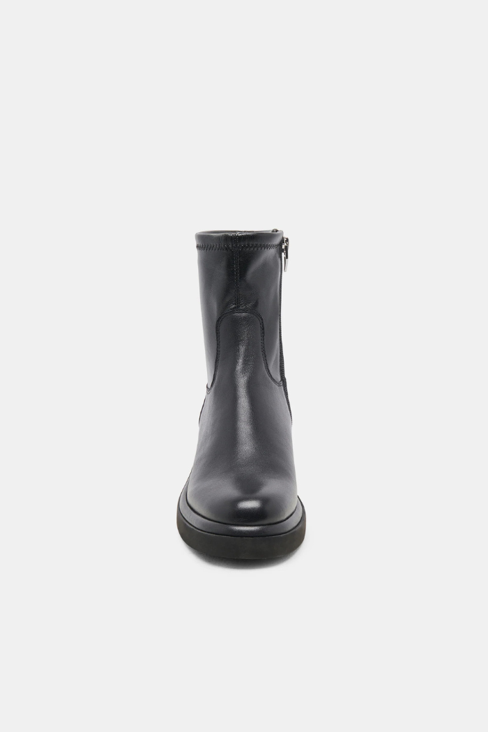 Black rubber boot on a white background