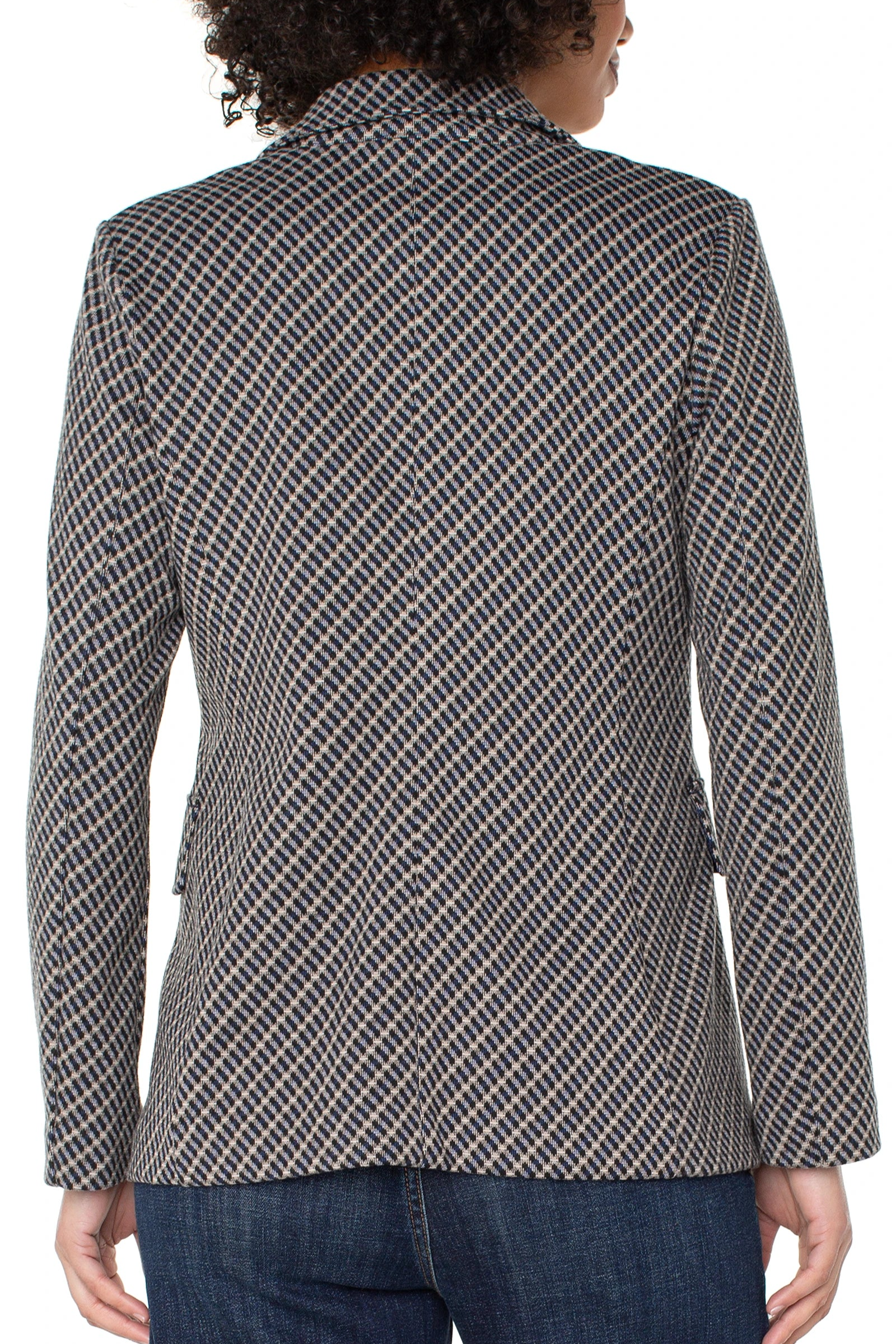 Person wearing a checkered blazer on a white background