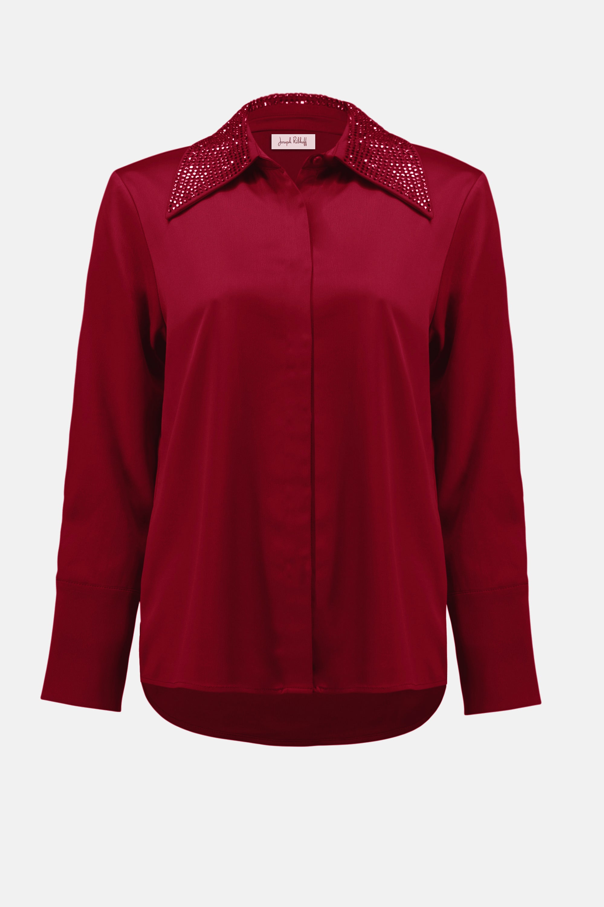 Red blouse with embellished collar on a white background