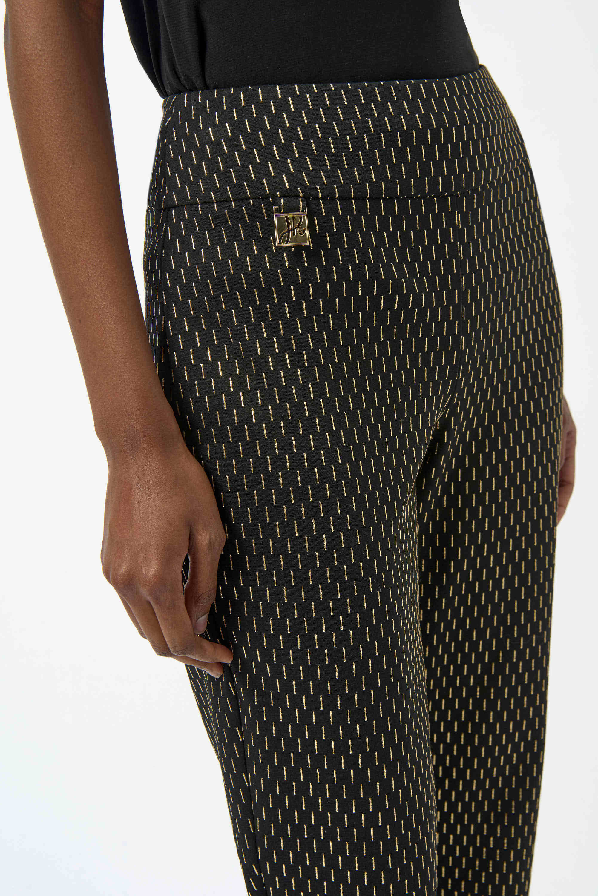 Patterned pants with a brand logo on a white background