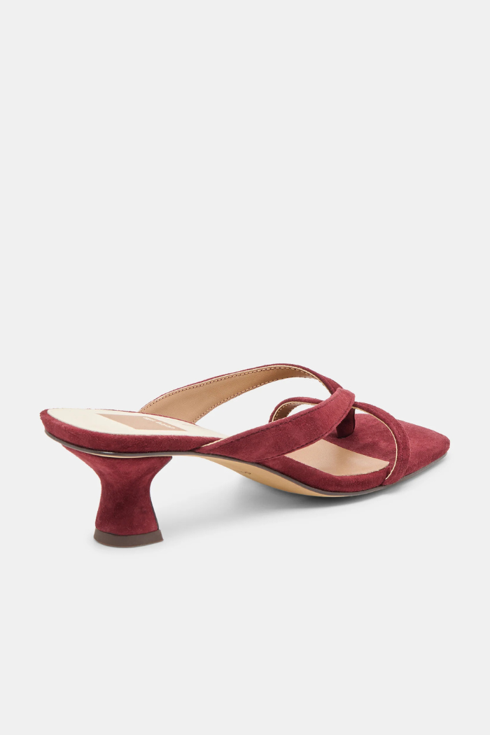 Red high-heeled shoe on a light gray background