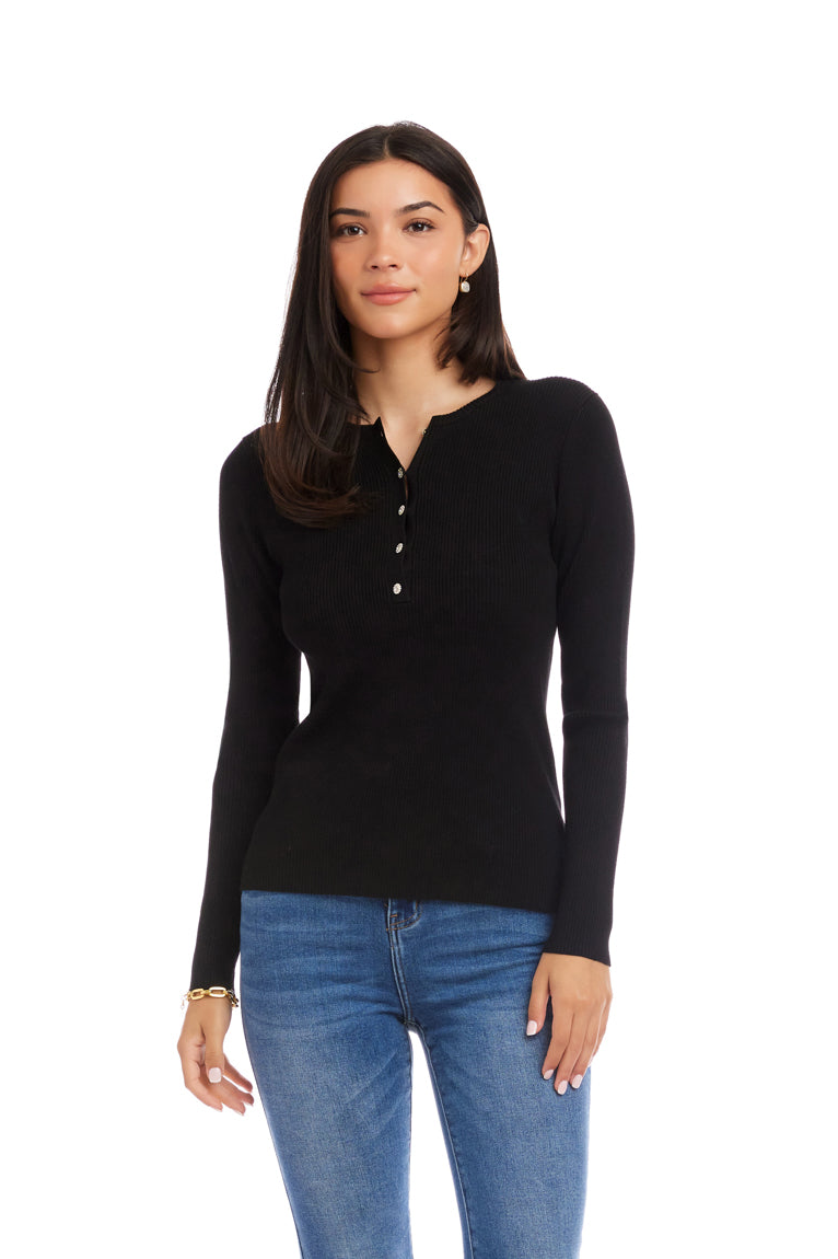 Woman wearing a black long-sleeve shirt and blue jeans on a white background