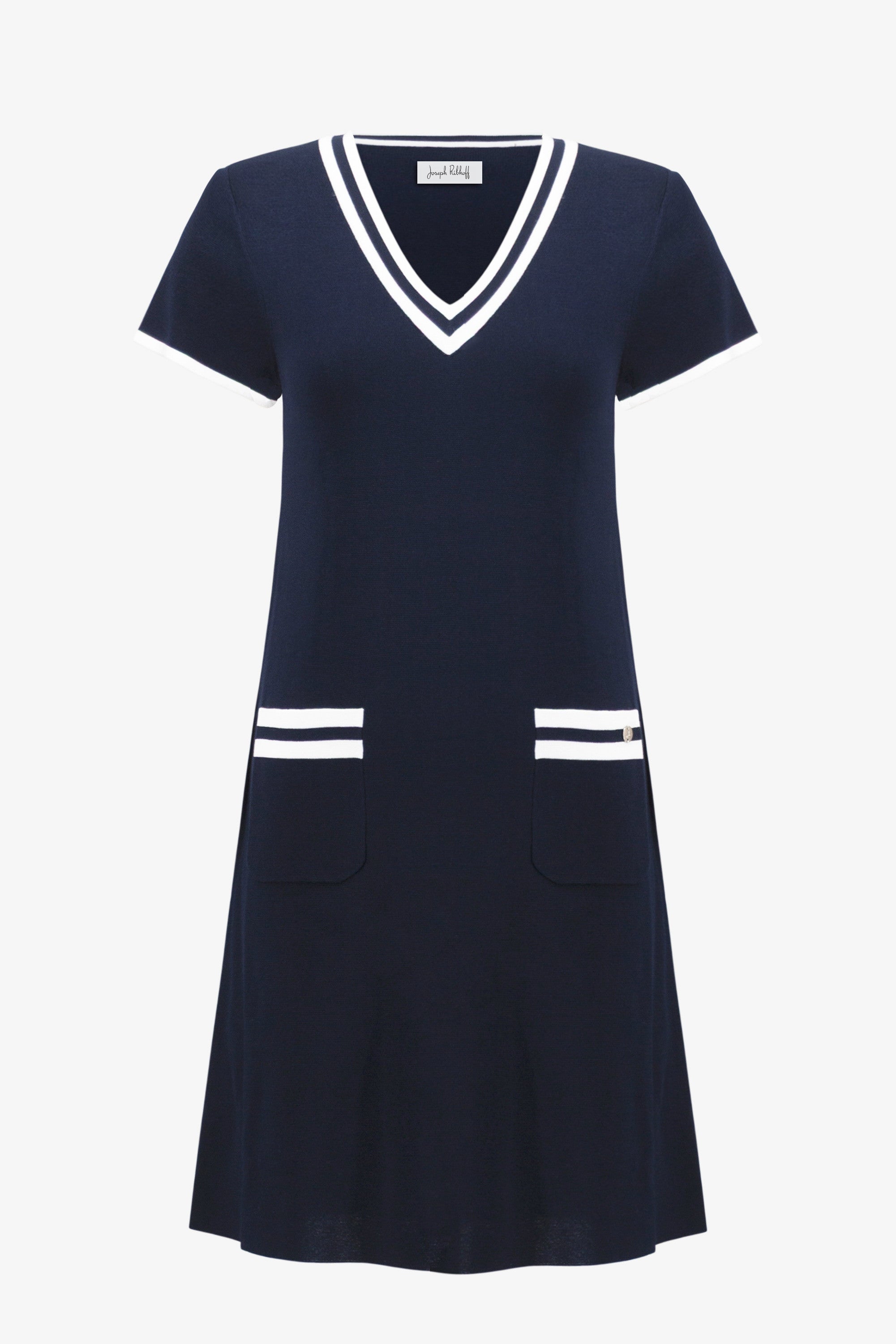 Navy dress with white accents on a white background