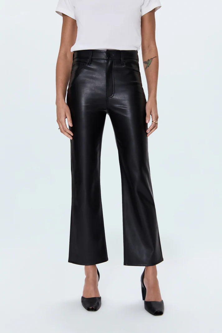 Person wearing black leather pants on a white background