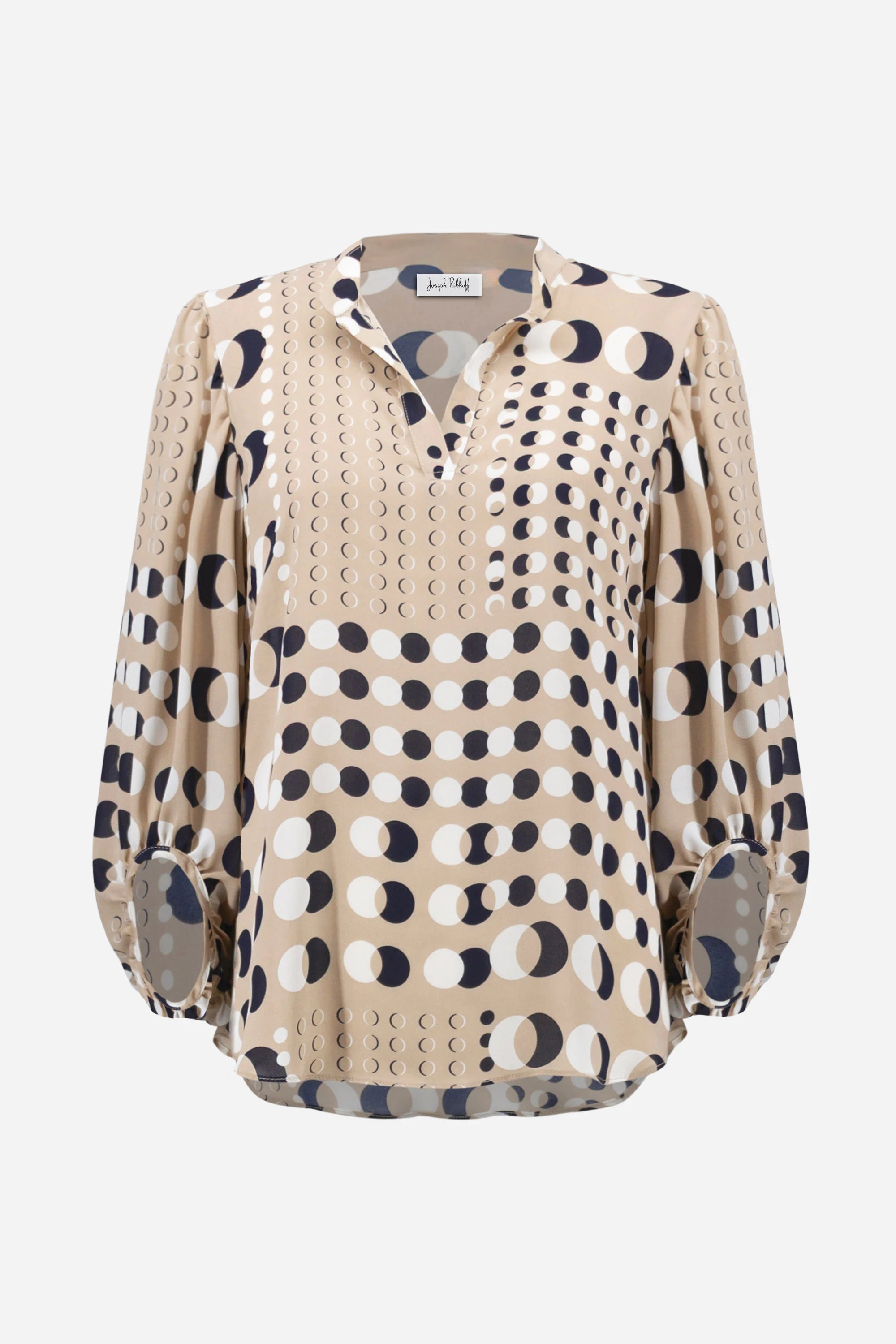 Beige blouse with black and white pattern on a white background