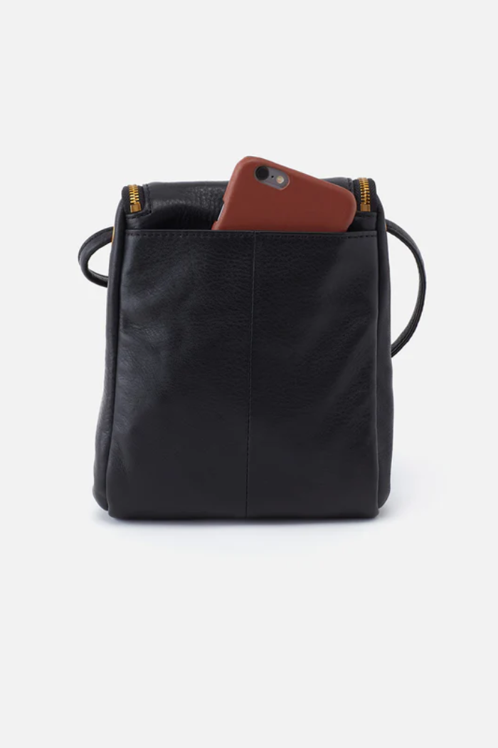 Black leather bag with a brown phone case on a white background