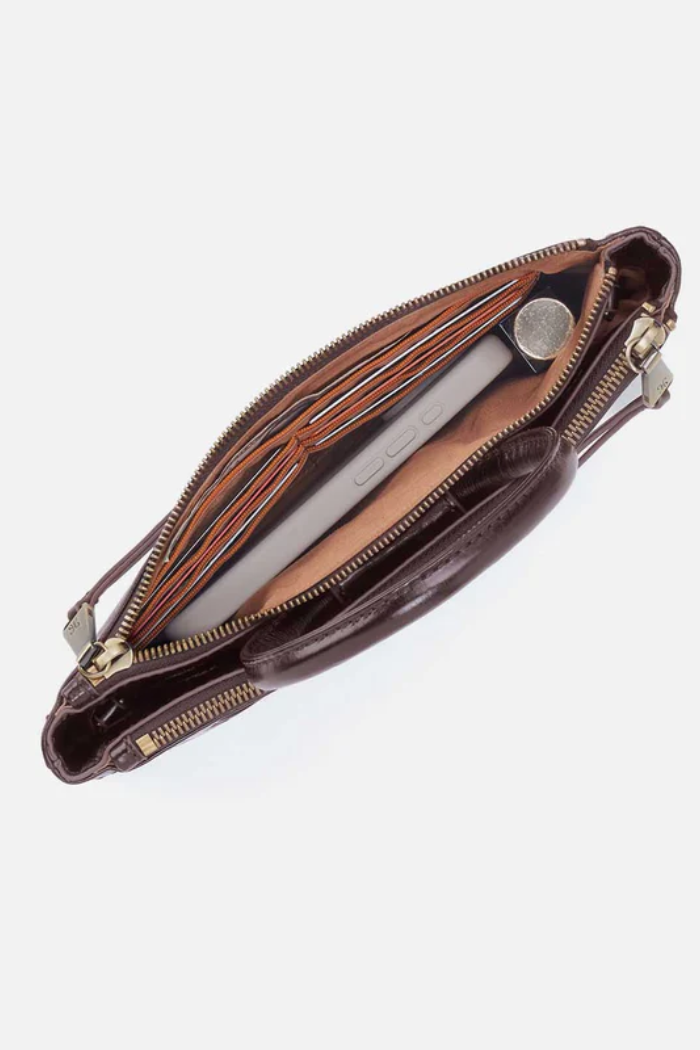 Brown leather clutch bag with gold zipper on a white background