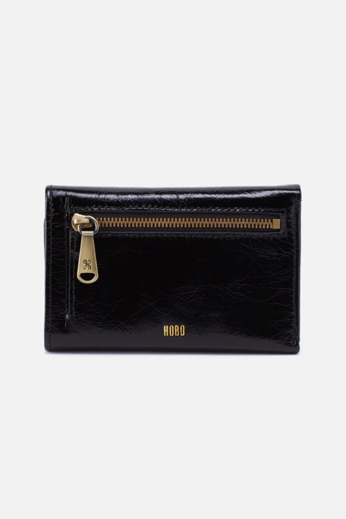 Black wallet with gold zipper and 'KARL' branding on a white background