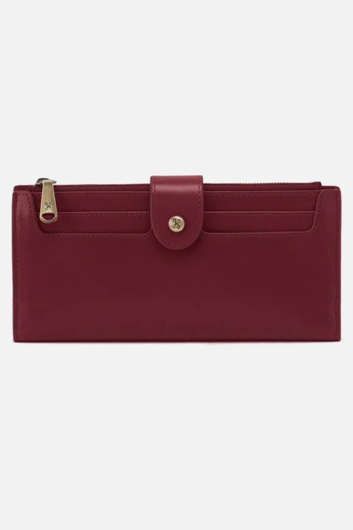 Red wallet with a gold buckle on a white background