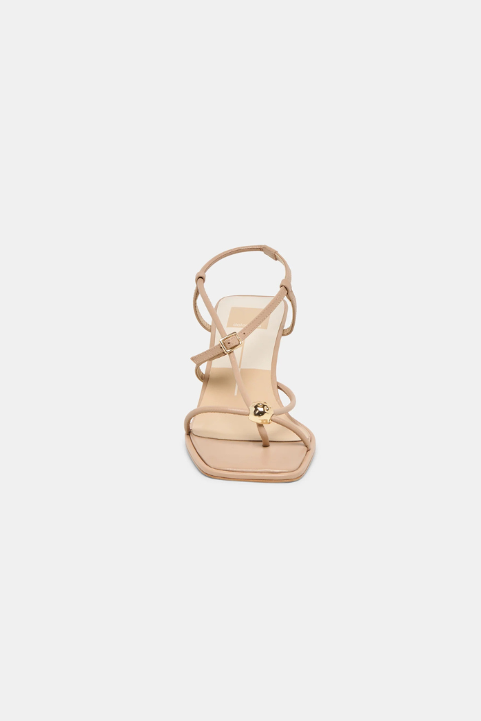 Beige high-heeled sandal on a light beige background