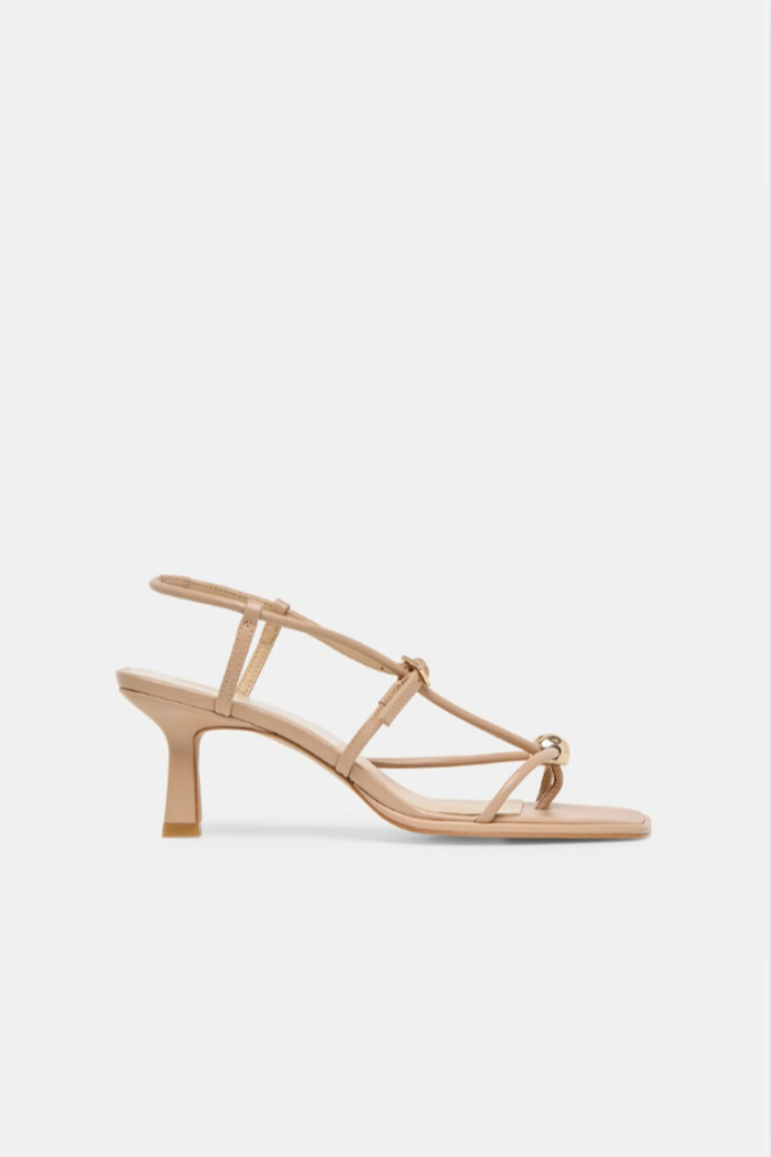 Beige sandal with thin straps on a light gray background