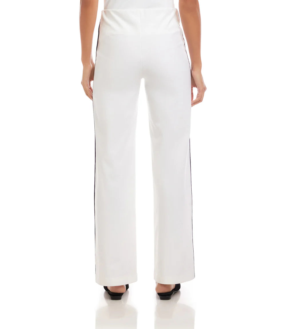 White pants worn by a person on a white background