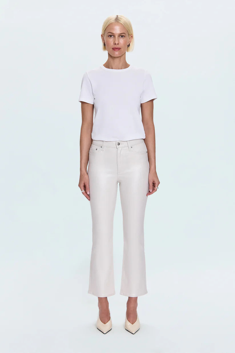 Person wearing a white t-shirt and light-colored pants on a white background
