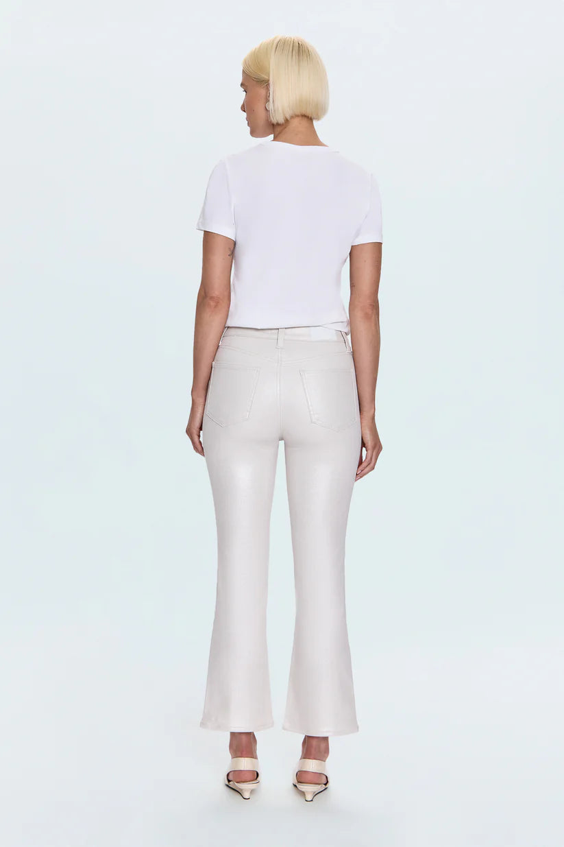 Person wearing a white t-shirt and light-colored pants on a plain background