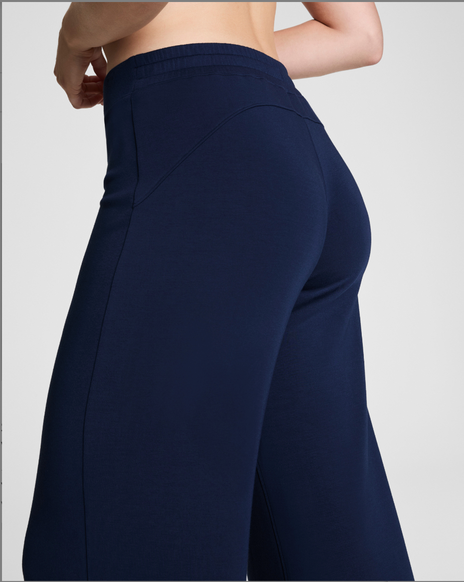 Navy blue wide-leg pants on a plain background