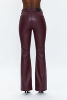 Maroon leather pants on a white background