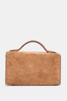 Brown leather handbag on a light gray background
