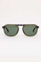 Sunglasses with green lenses and black frames on a white background