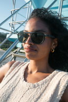 Woman wearing sunglasses with a blurred background