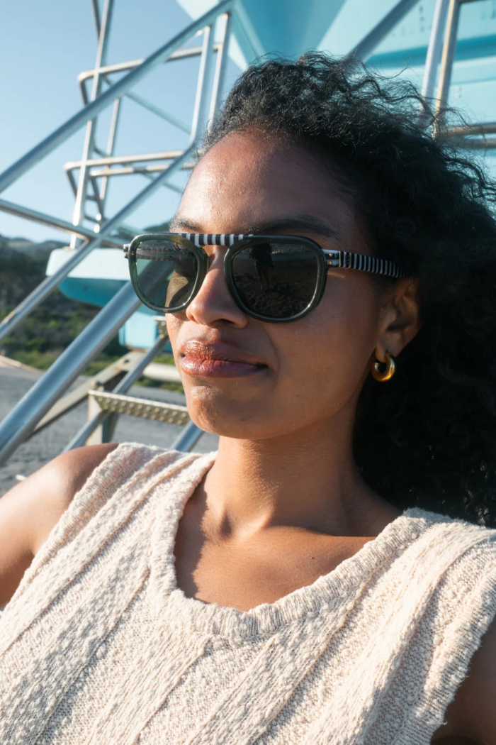 Woman wearing sunglasses with a blurred background