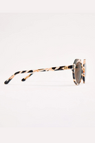 Sunglasses with tortoiseshell frame on a white background