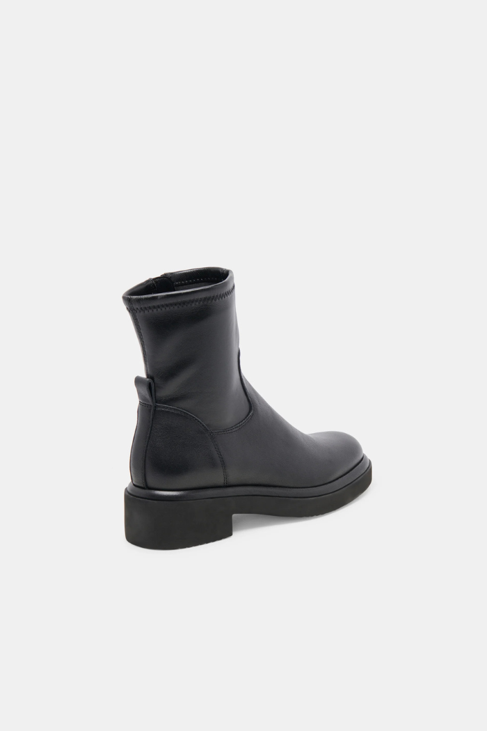 Black rubber boot on a white background