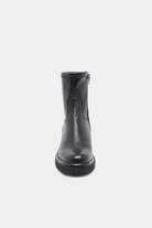 Black rubber boot on a white background