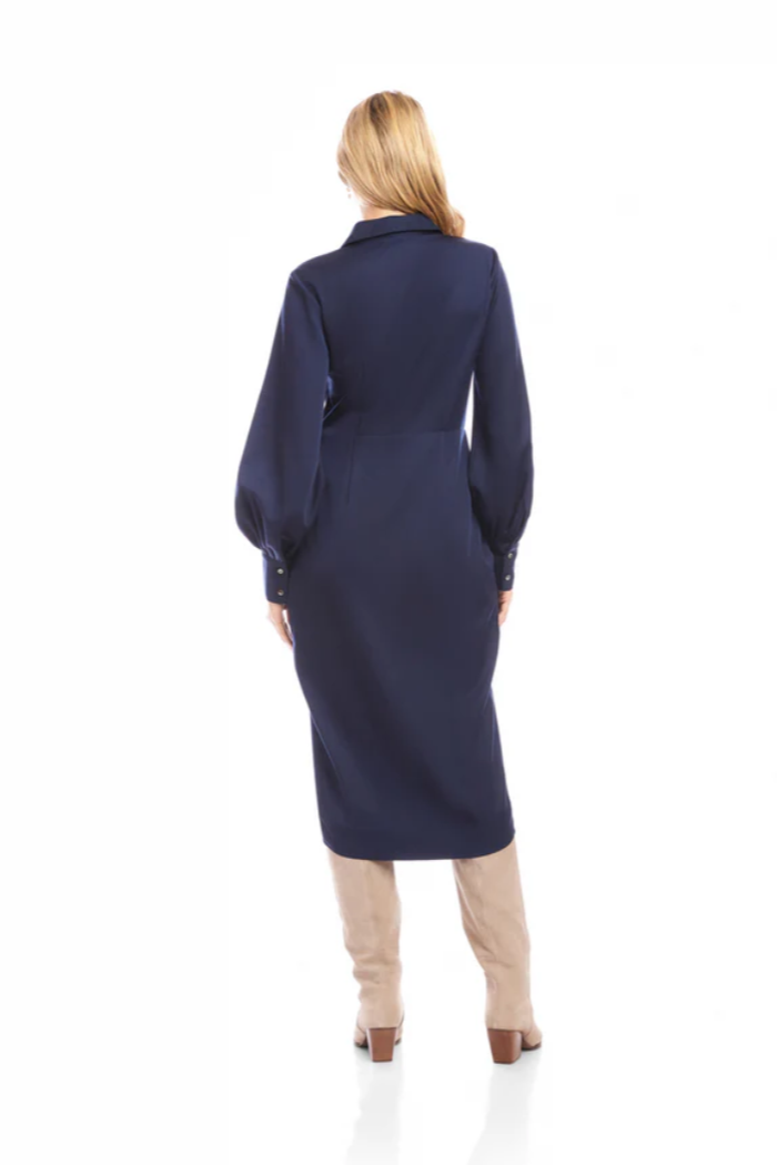 Woman wearing a navy blue coat on a white background