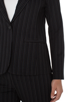 Black pinstripe suit jacket on a white background