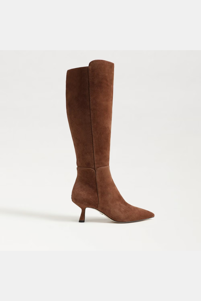 Brown knee-high boot on a white background