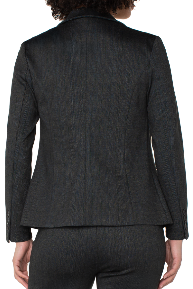 Black suit jacket worn by a person on a white background