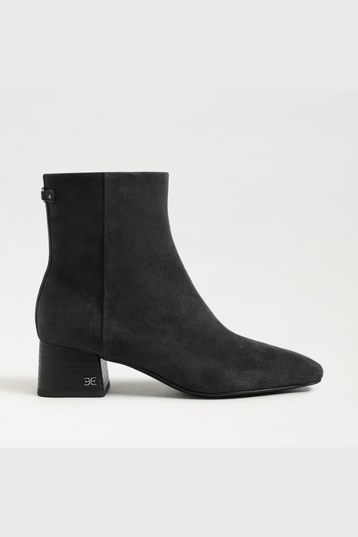 Black suede ankle boot on a white background