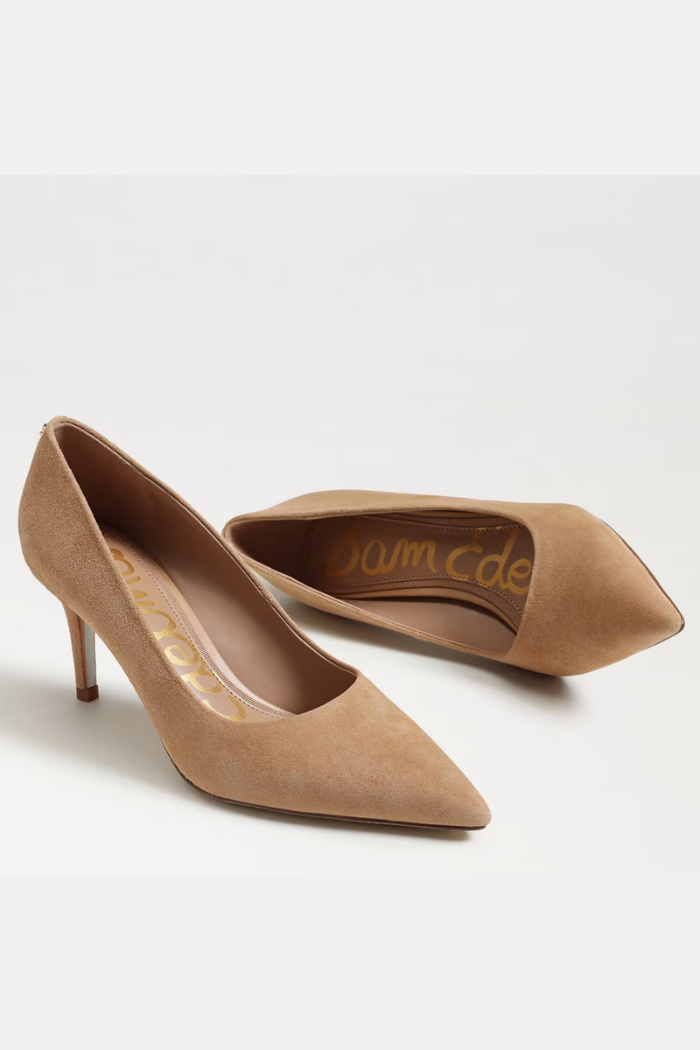 Pair of tan high-heeled shoes on a white background
