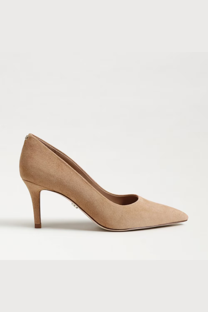 Beige high-heeled shoe on a light beige background