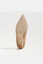 Beige high-heeled shoe on a white background
