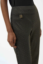 Patterned pants with a brand logo on a white background