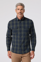 Man wearing a plaid shirt on a white background