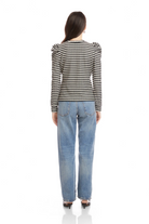 Woman wearing a striped shirt and jeans on a white background