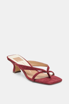 Red sandal with a thin strap on a white background
