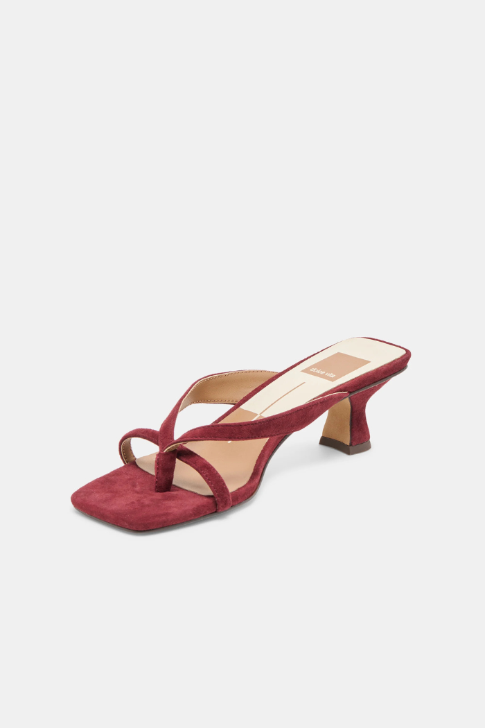 Red sandal with a low heel on a white background