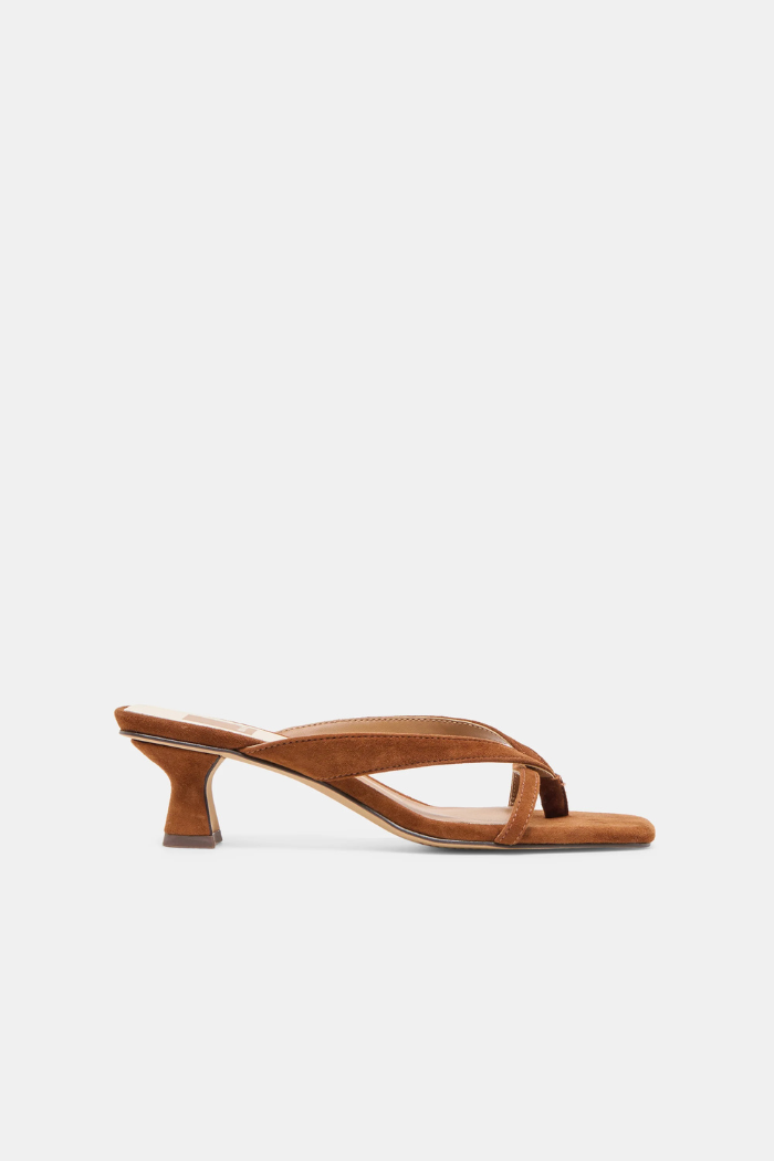Brown sandal with a thin strap on a white background